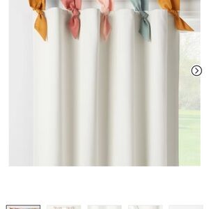 Elegant White Curtains with Multicolor Tiebacks